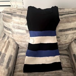 Super cute sleeveless dress. Size S. The bottom half is spandex.